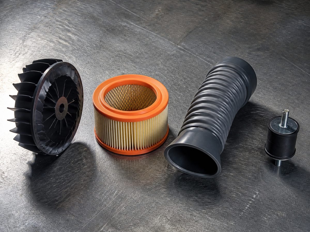 Blower parts laid out on a workshop bench